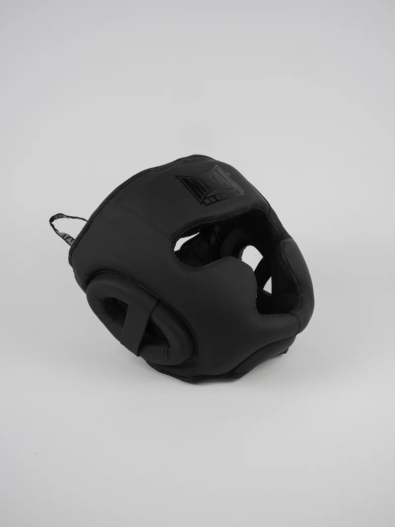 Front view of the matt black Metal Boxing Full Face "Black Light" helmet with integrated cheekbone guards and chin guard