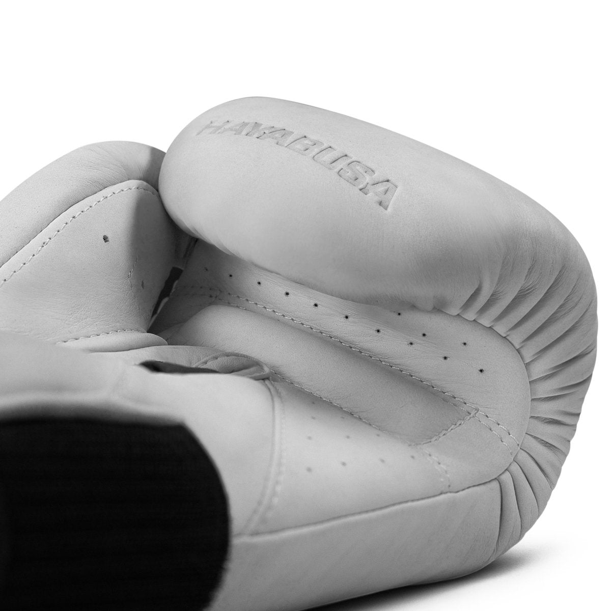 Close-up view of the palm of the white Hayabusa T360 glove, handcrafted finishes and ventilation holes