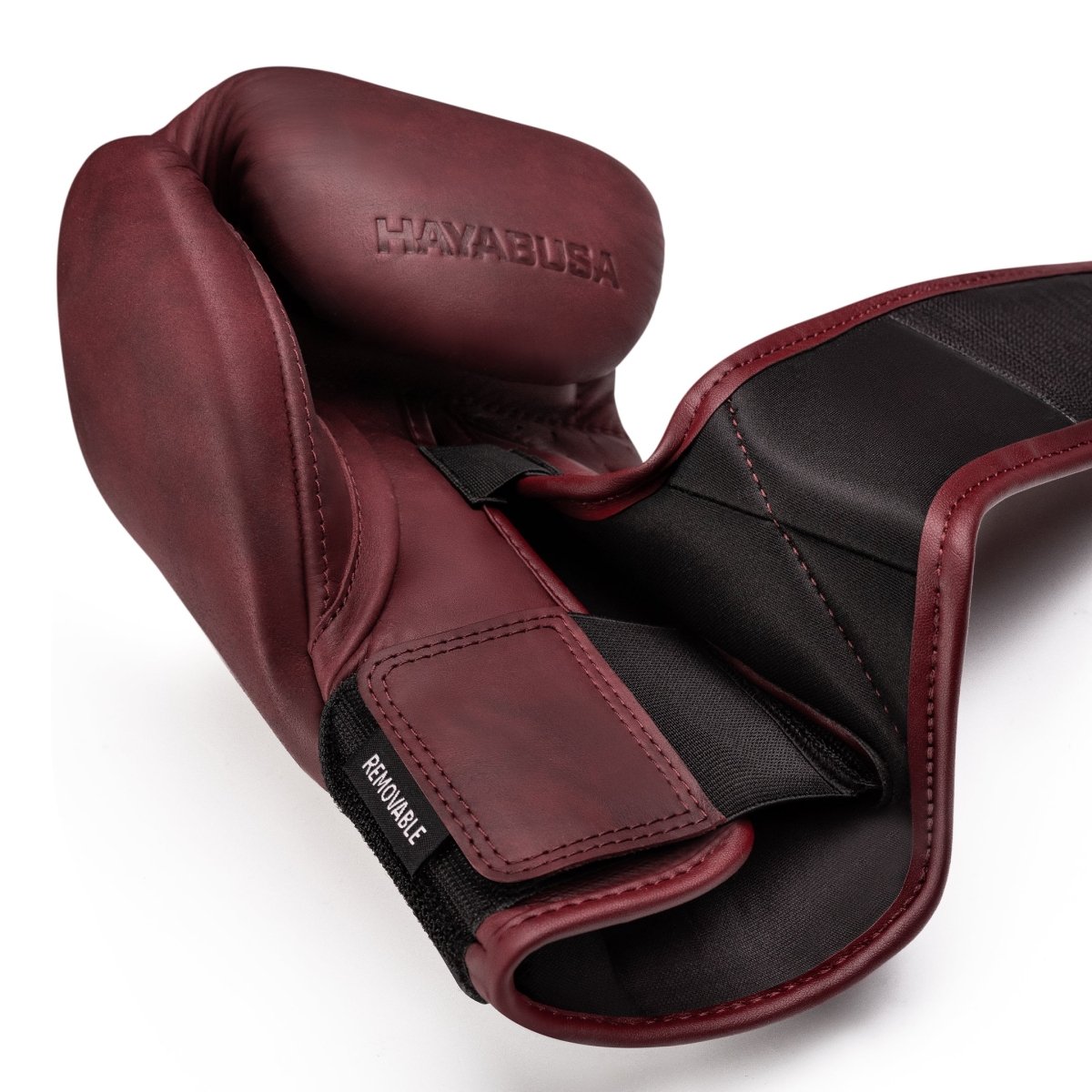 Hayabusa T360 burgundy single glove, detail of the removable straps for a personalized fit