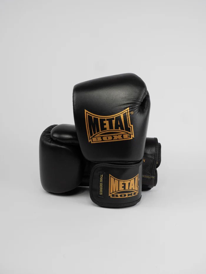 Front view of the Metal Boxing Thai Series gloves in black and gold full grain leather