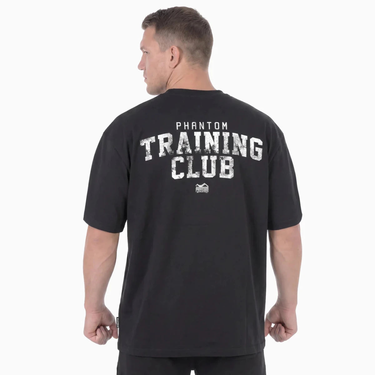 Vista trasera de la camiseta Phantom negra extragrande con el gran gráfico Training Club en la espalda