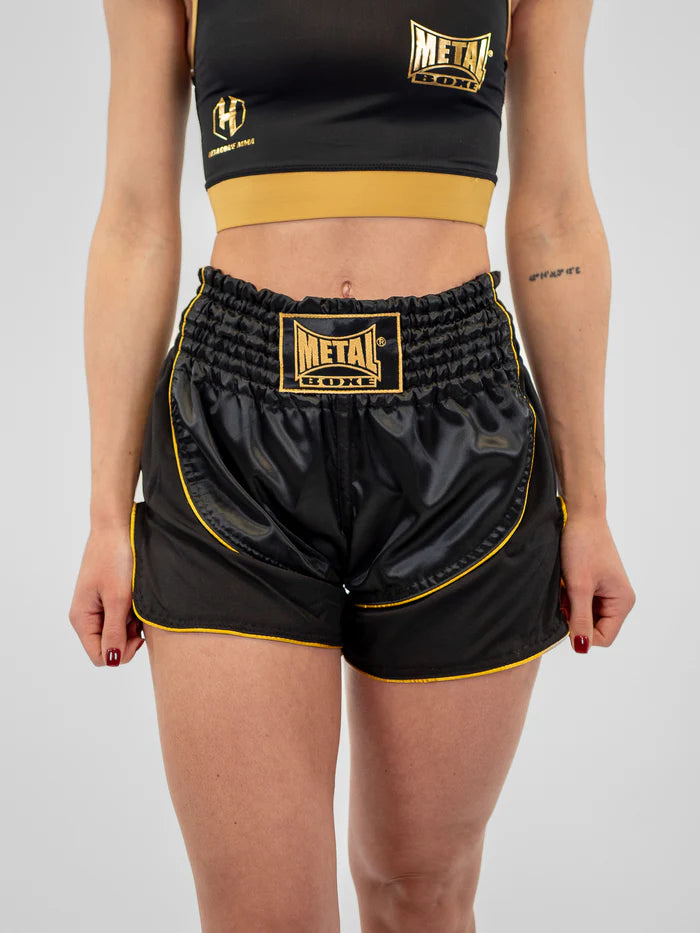 Vista frontal pantalón corto de Kickboxing mujer Metal Boxe Siam negro dorado satinado