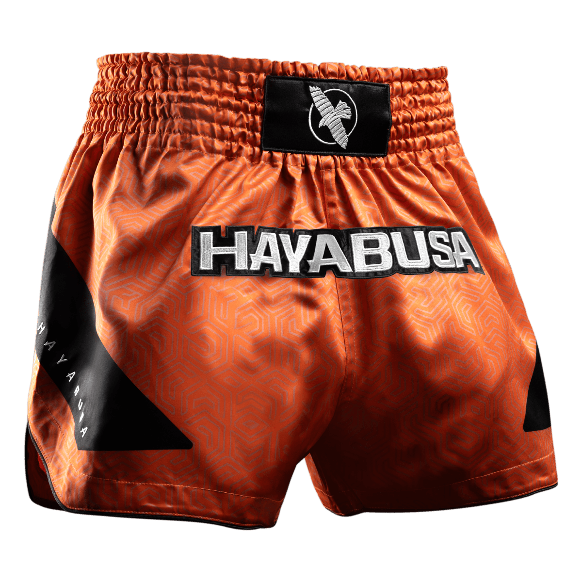 Pantalón corto naranja Muay Thai Hayabusa Core visto de frente en tejido satinado
