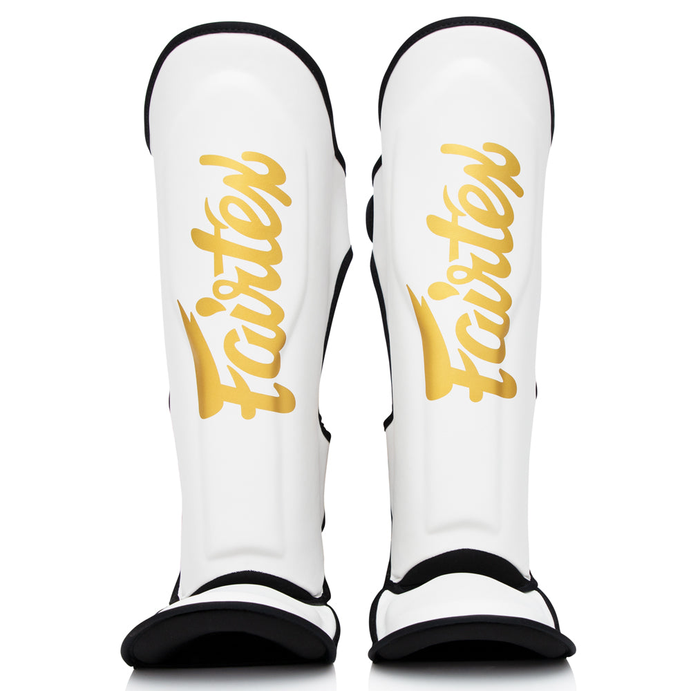 Espinilleras profesionales FXB Fairtex Blanco óptico para combate intensivo