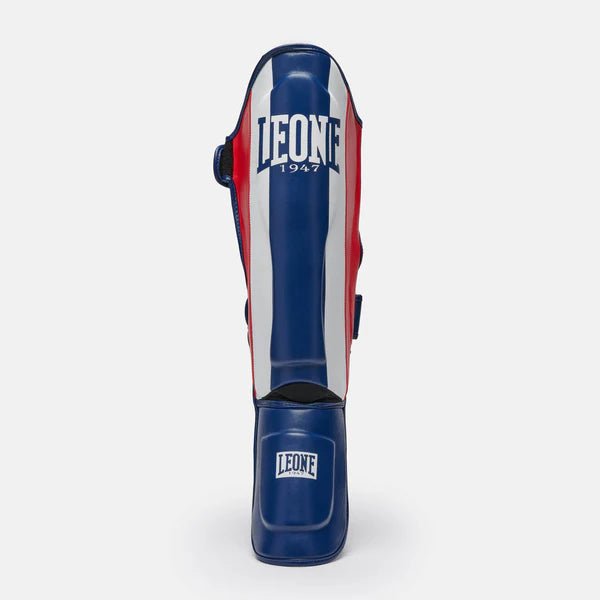 Pelindung tulang kering depan biru blok warna Leone dengan detail pelindung. Olahraga tempur dan kick boxing