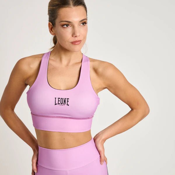 Vista frontal de la camiseta deportiva técnica Leone Stripe 47 en color rosa con detalles gráficos