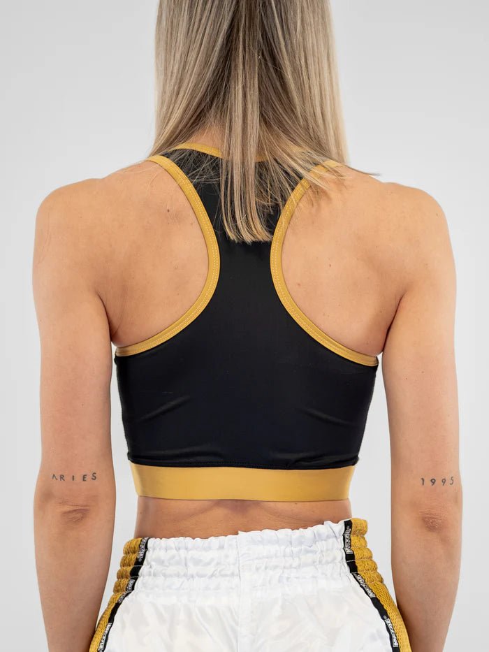 Vista posterior Sujetador deportivo Metal Boxing negro dorado detalle cruz ergonómica