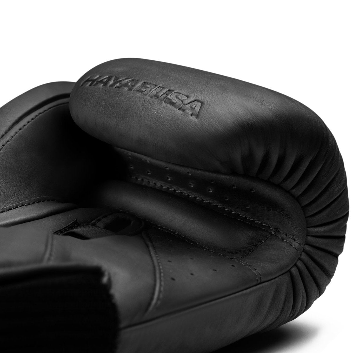 Detail of the palm of the black Hayabusa T360 gloves, showing the ergonomic grip bar and breathable lining