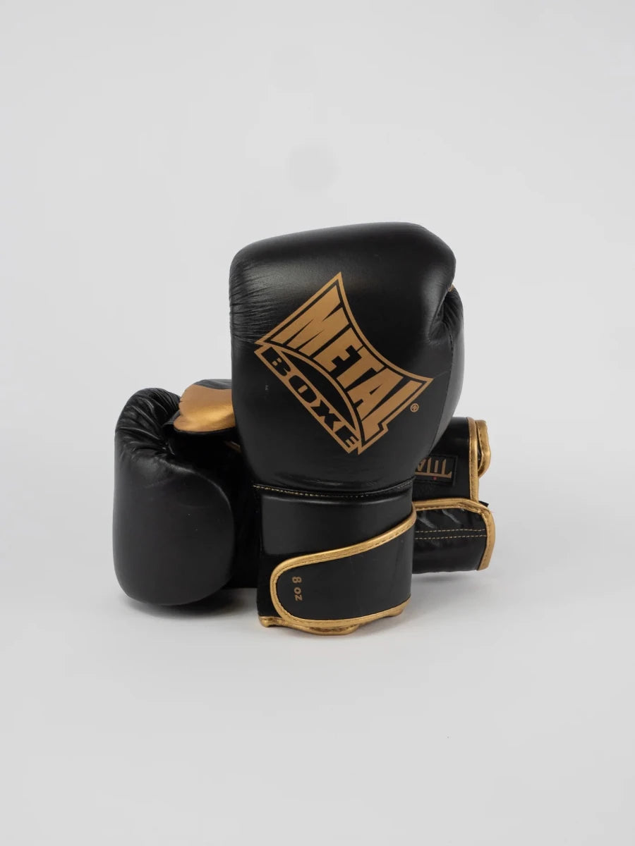 Pair of Metal Boxing Titan gloves in black and gold leather, overall view
