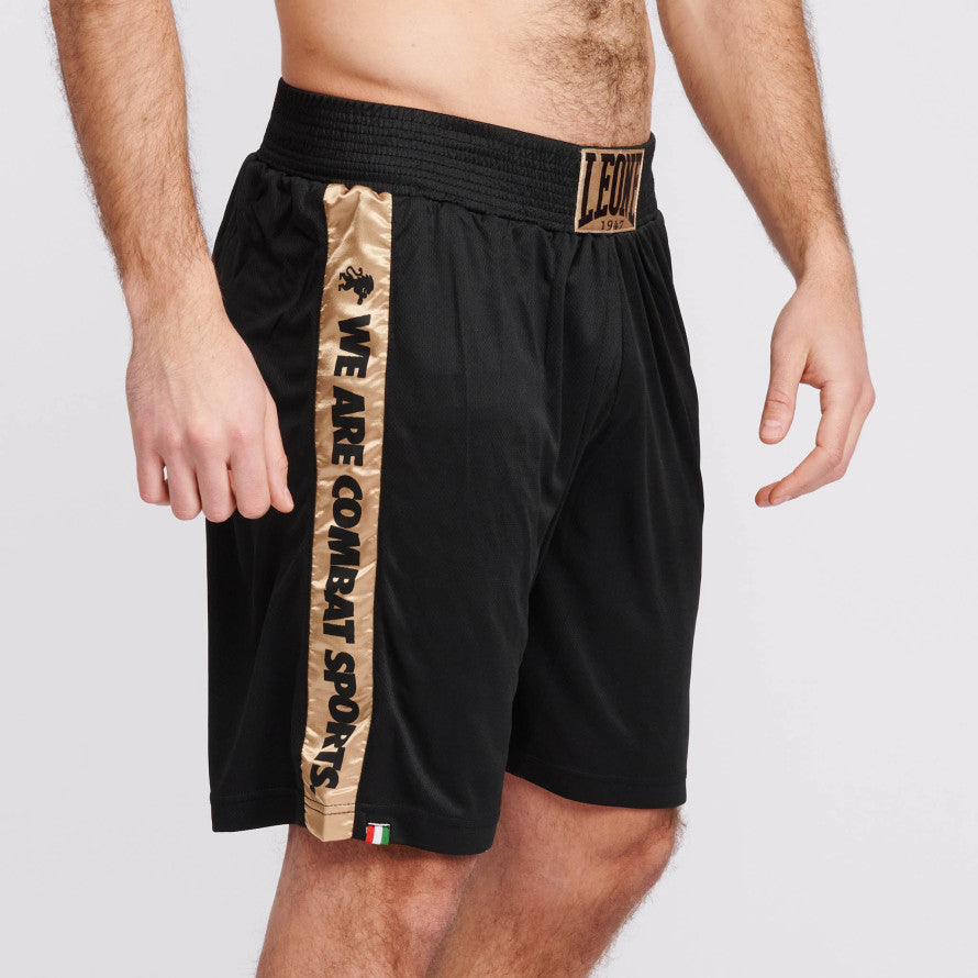 Pantalones cortos de boxeo negro oro León Dna
