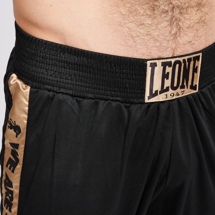 Pantalones cortos de boxeo negro oro León Dna